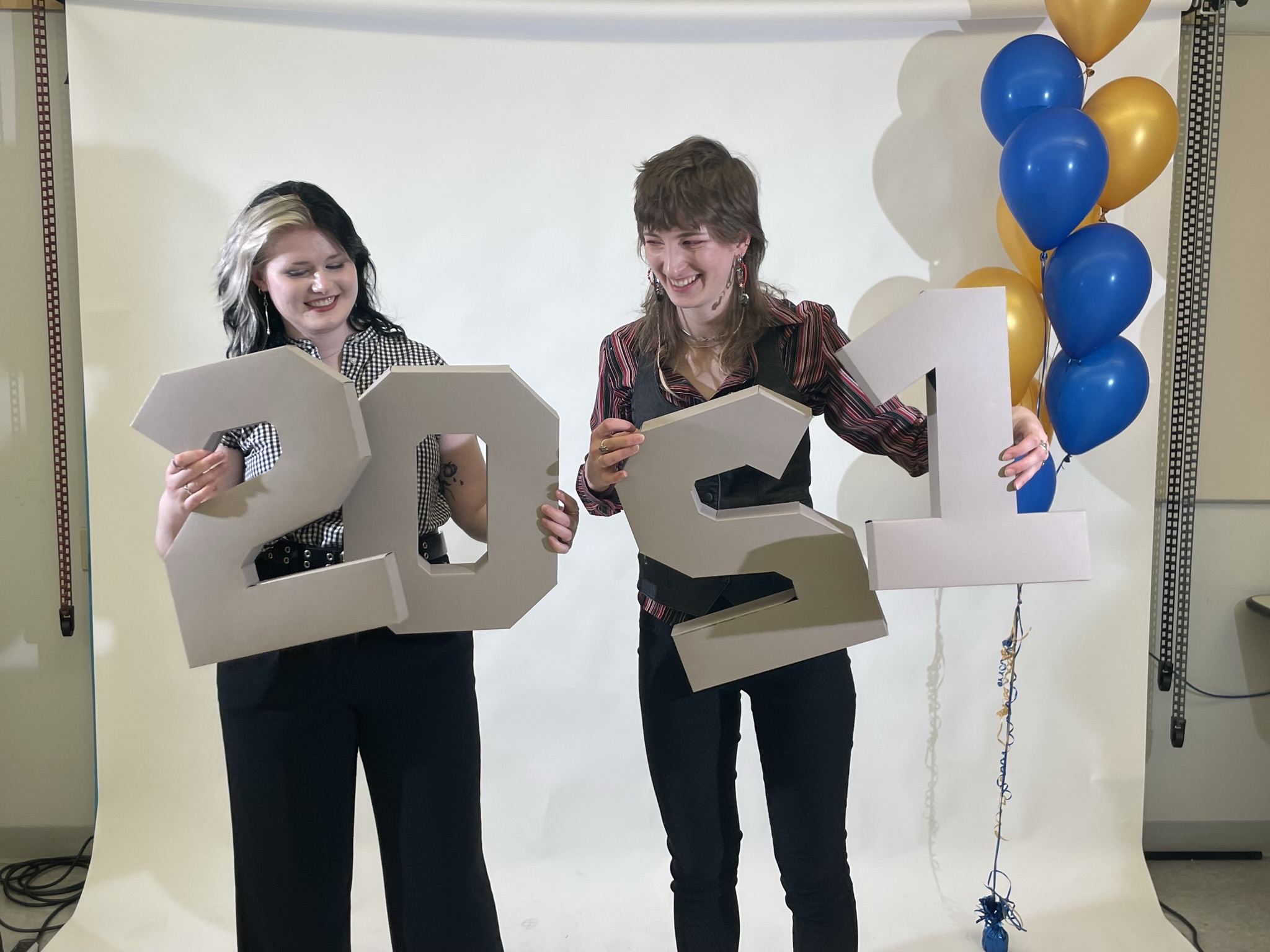 Posing with my friend Laura and cartons shaped into our graduation year at GCM Alumni Night
